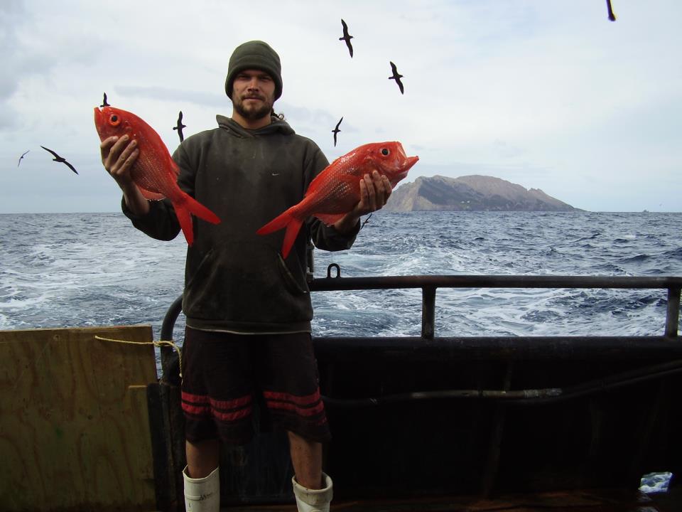 Commercial fisherman with 2 nice redfish nannygai